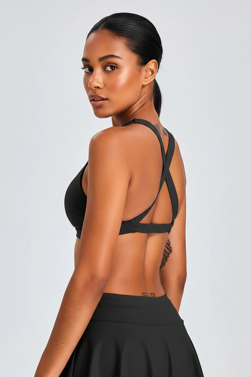 Back view – black cross-back sports bra, no tattoos