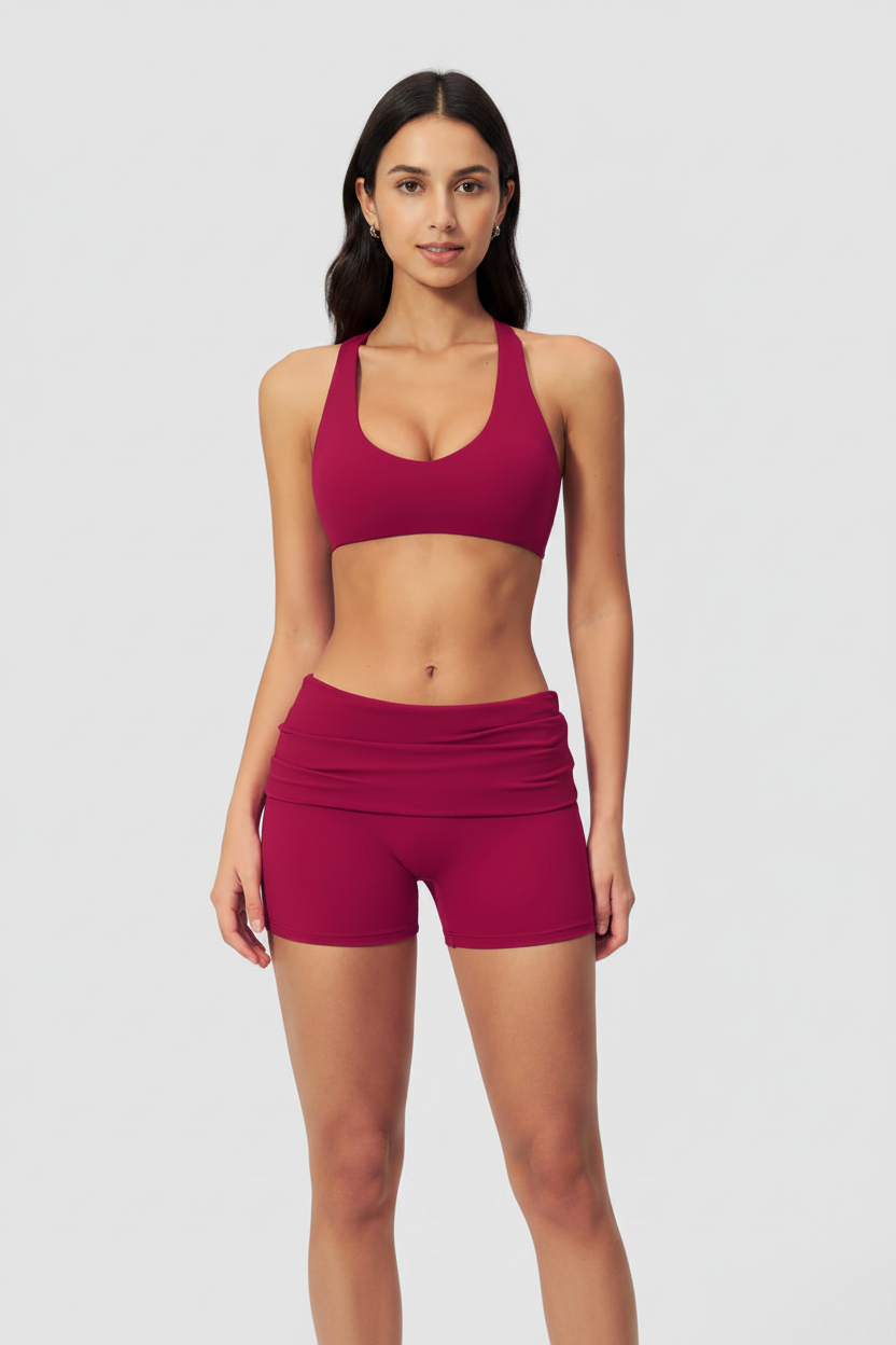 Front – magenta cross-back sports bra with face