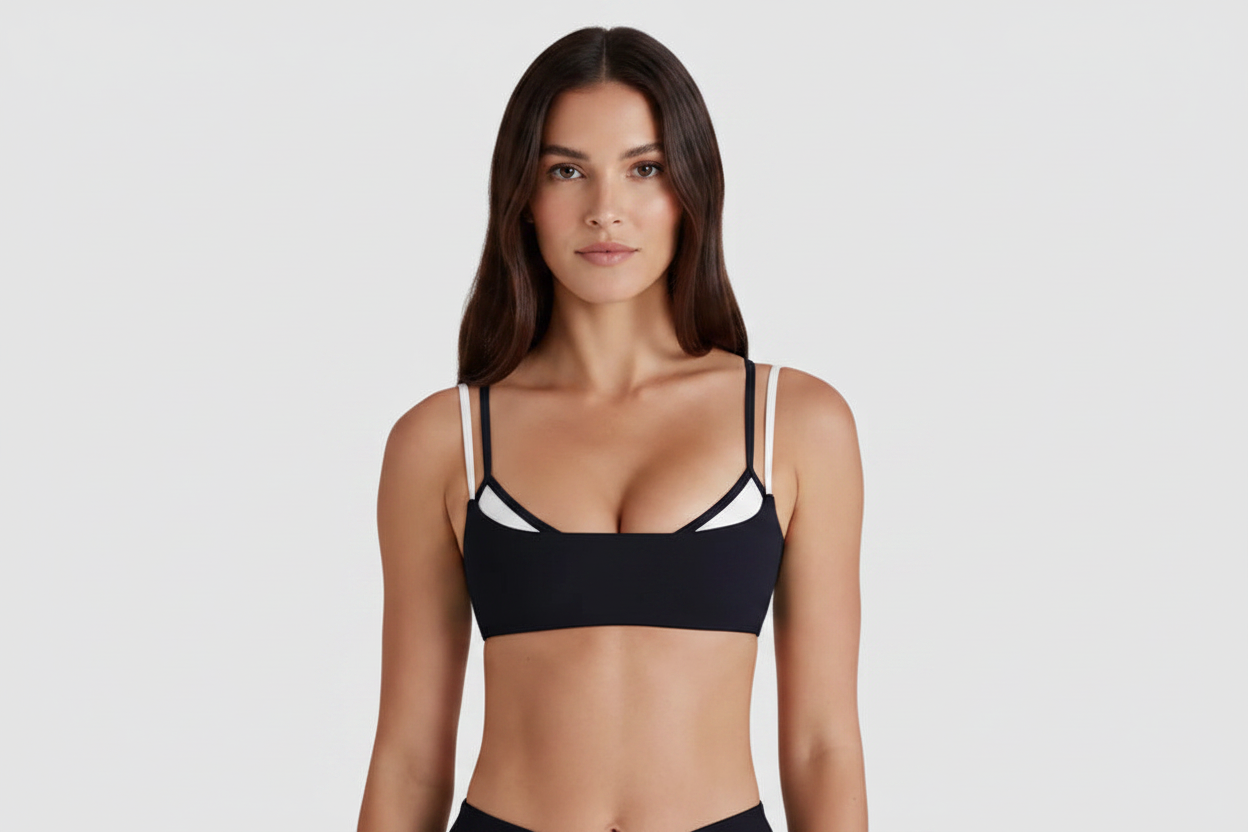 Model with face - black double strap sports bra front